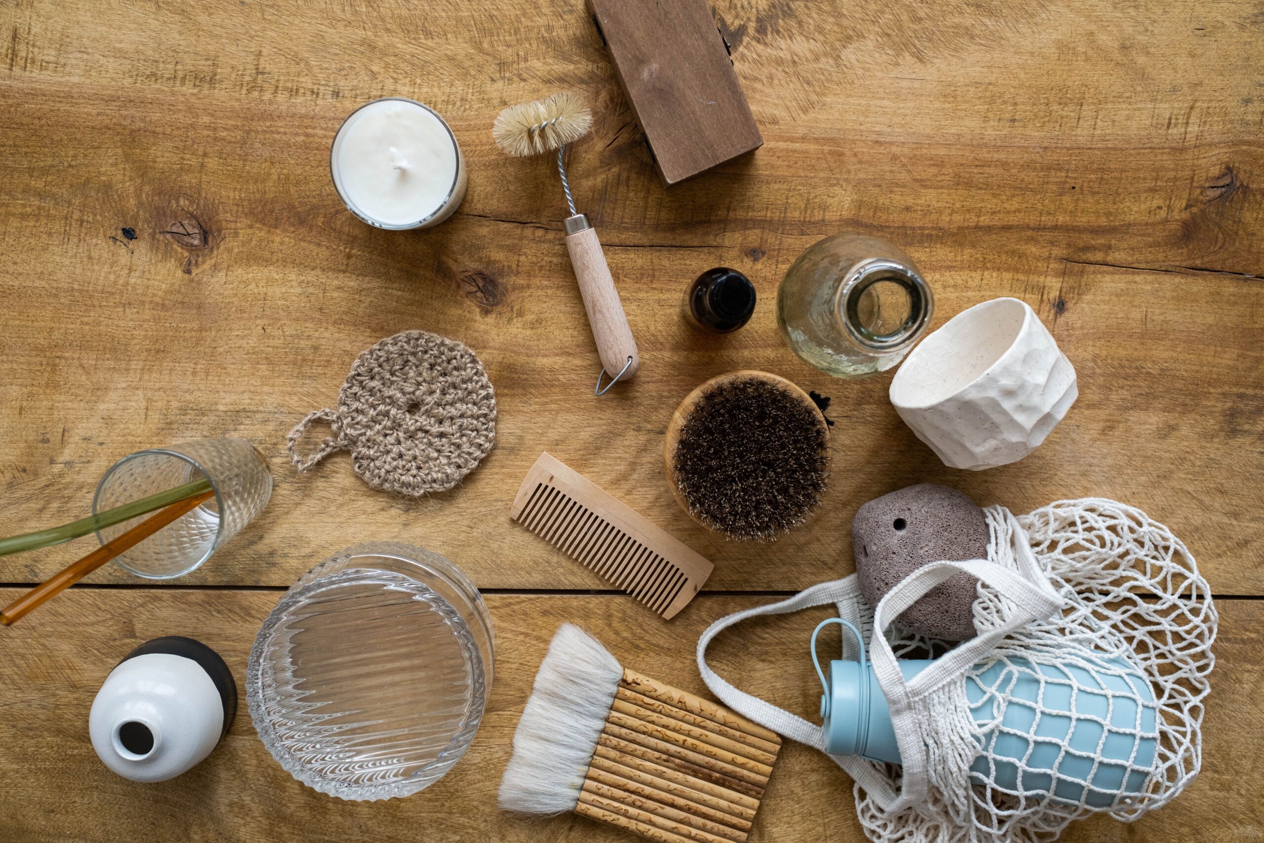 Reusable household items arranged on a wooden surface